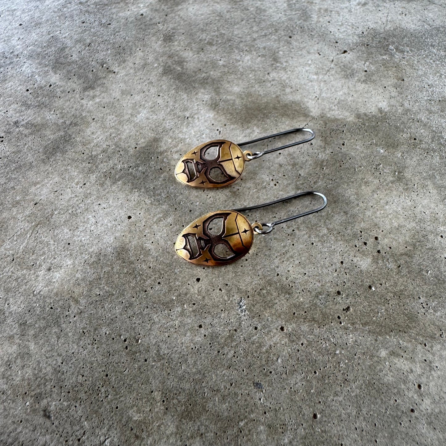 Luchador brass dangle earrings