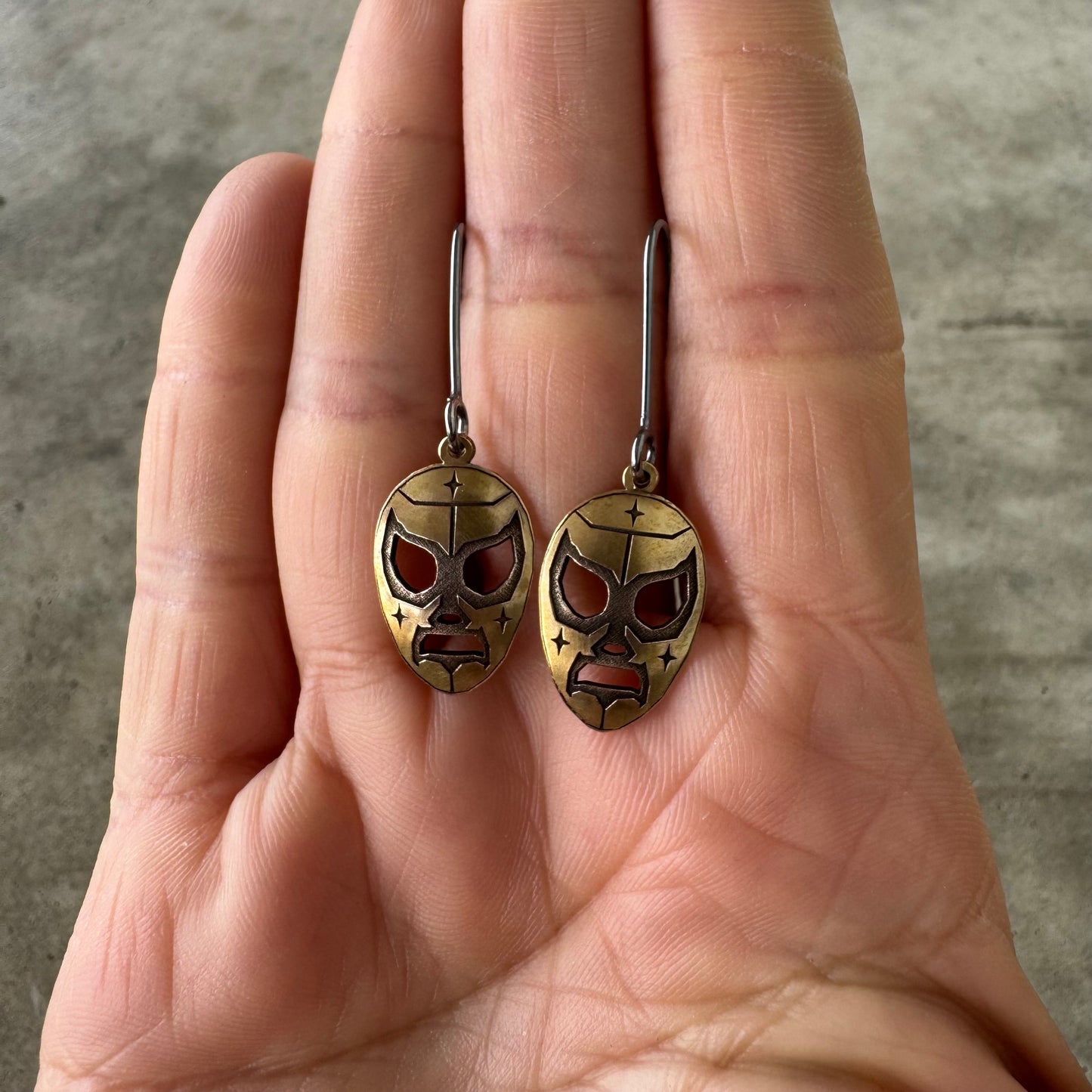 Luchador brass dangle earrings